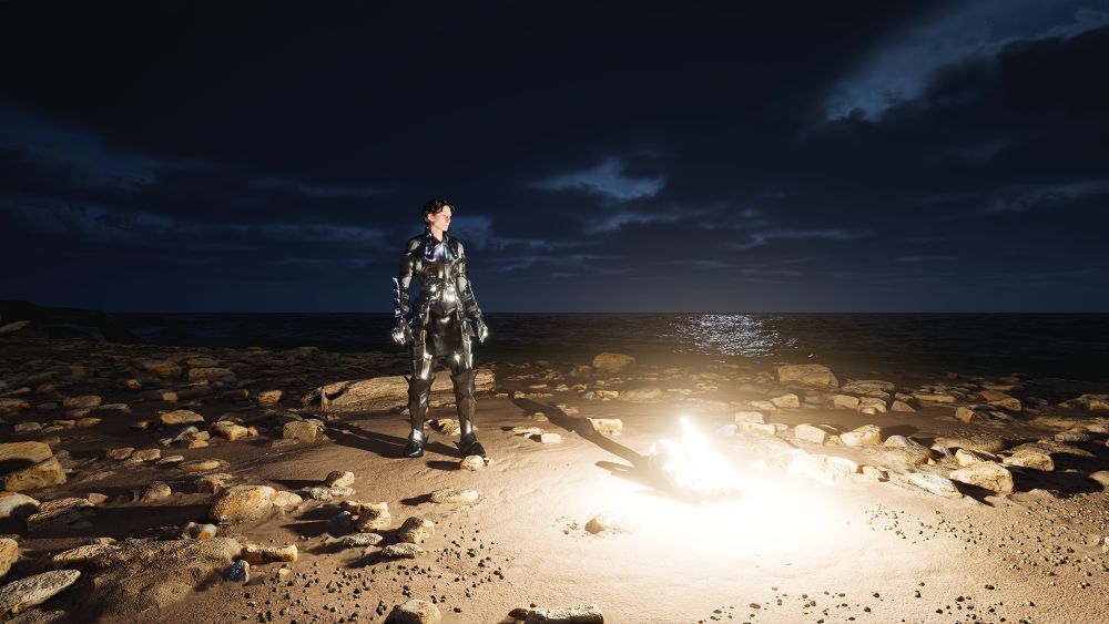 Video game characters stands on a beach at night.